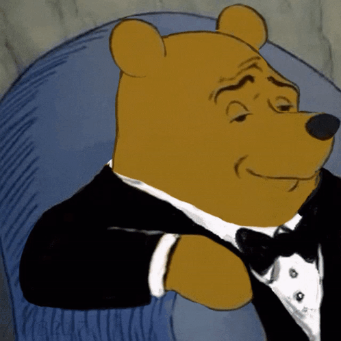 Cartoon Bear in Tuxedo and Bow Tie Sitting in Chair