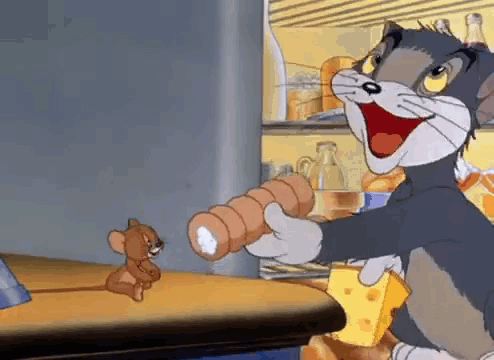 Cartoon Cat Holding Sausage Roll And Cheese While Mouse Looks On GIF