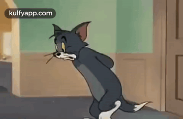 Cartoon Cat In Hallway With Mouse In Mouth GIF