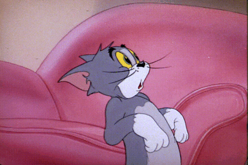 Cartoon Cat Sitting On Pink Chair GIF