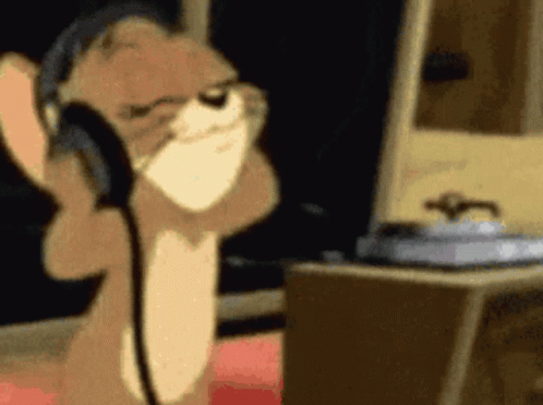 Cartoon Cat Wearing Headphones at Computer