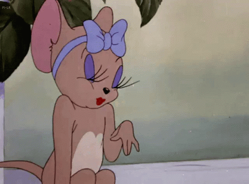 Cartoon Cat With Blue Bow Sitting Down