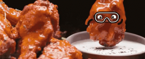 Cartoon Character Dipped In Buffalo Wings GIF