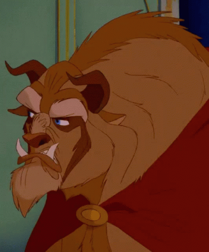 Cartoon Character Face With Horns And Blue Eyes