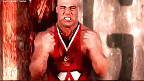 Cartoon Character Flexing Muscles With Heart On Belt GIF