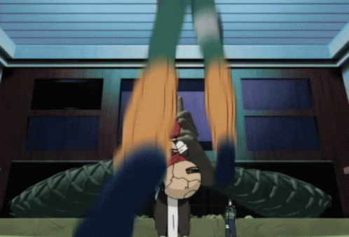 Cartoon Character Hanging Upside Down in Front of Tire