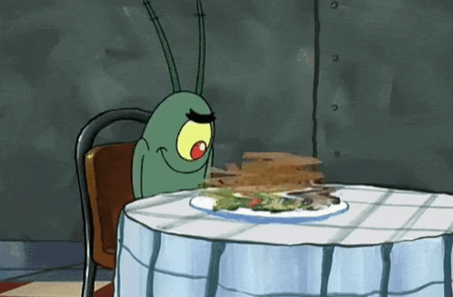 Cartoon Character Holding Knife and Fork at Table