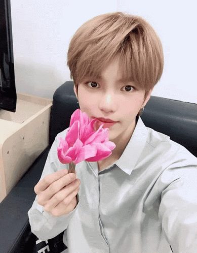 Cartoon Character Holding Pink Book On Chair GIF