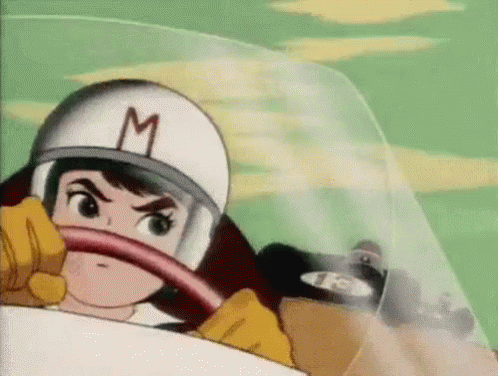 Cartoon Character in Helmet With M Driving Race Car