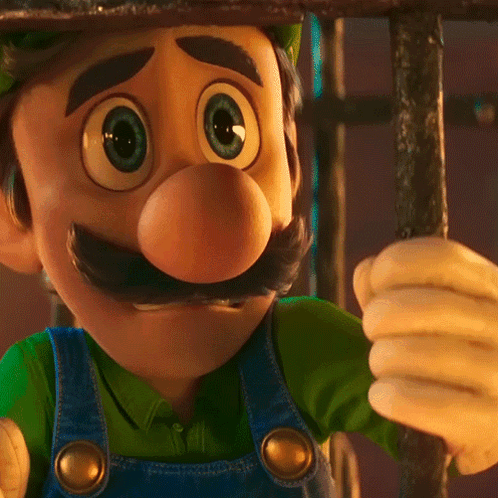 Cartoon Character In Overalls And Hat Close Up GIF