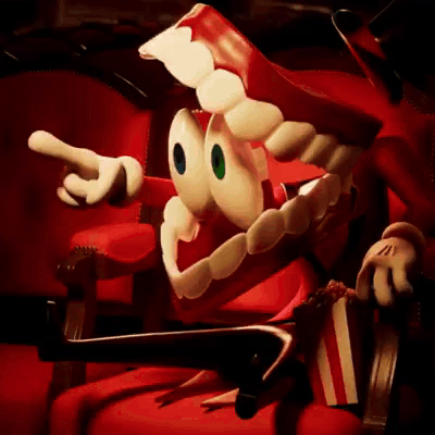 Cartoon Character In Red Chair Holding Popcorn And Pointing GIF