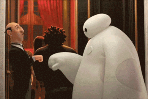 Cartoon Character in Tuxedo Next to White Bear