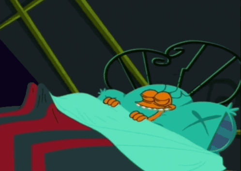 Cartoon Character Laying In Bed With Cross Pillow GIF