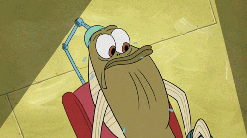 Cartoon Character Laying in Chair With Lamp on Head