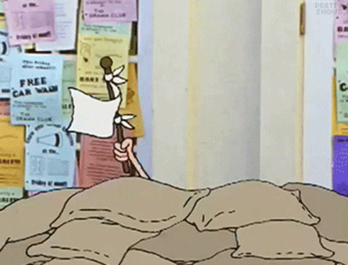 Cartoon Character Laying on Pile of Pillows by Free Car Wash Ad