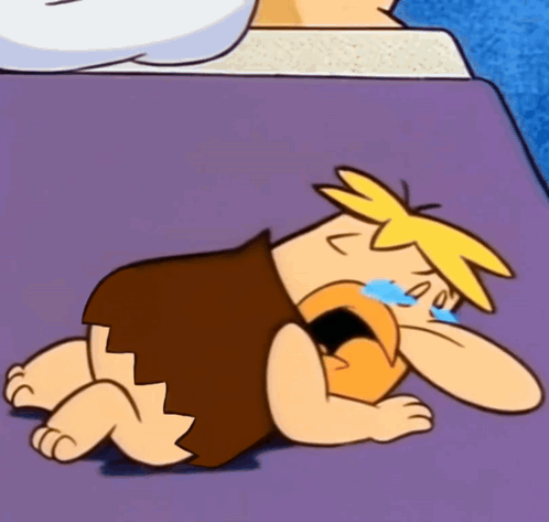 Cartoon Character Laying on Purple Surface Crying