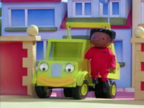 Cartoon Character Next to Toy Truck