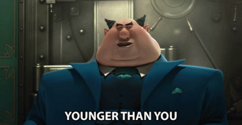 Cartoon Character Says Younger Than You In Front Of Vault GIF