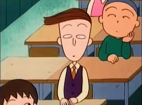 Cartoon Character Sitting at Desk in Classroom Eyes Closed