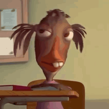 Cartoon Character Sitting at Desk With Book