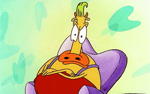 Cartoon Character Sitting in Chair With Letter C