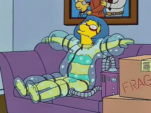 Cartoon Character Sitting on Couch Next to Fragile Box