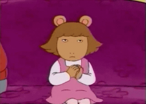 Cartoon Character Sitting On Purple Couch GIF