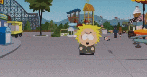 Cartoon Character Standing in Front of Roller Coaster
