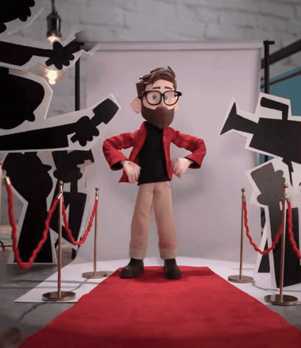 Cartoon Character Standing on Red Carpet in Front of Cameras