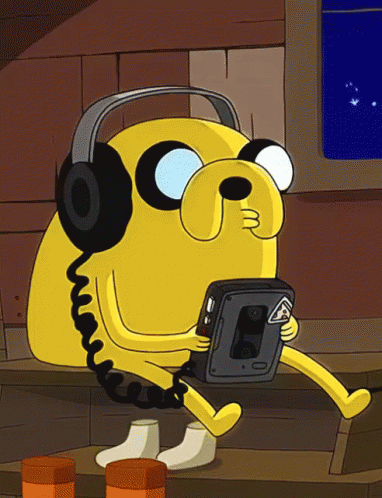 Cartoon Character Wearing Headphones And Holding Cassette Tape Player GIF