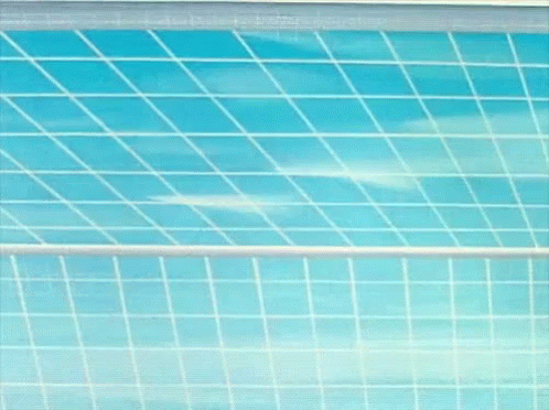 Cartoon Character Wearing Red Hat in Front of Grid Wall