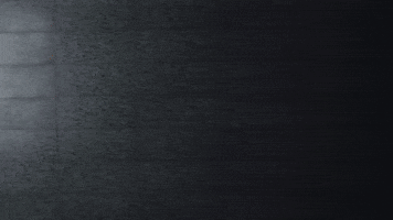 Cartoon Character With Beanie On Street At Night GIF
