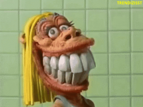 Cartoon Character With Big Teeth Holding Toothbrush