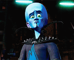 Cartoon Character with Blue Head and Green Eyes