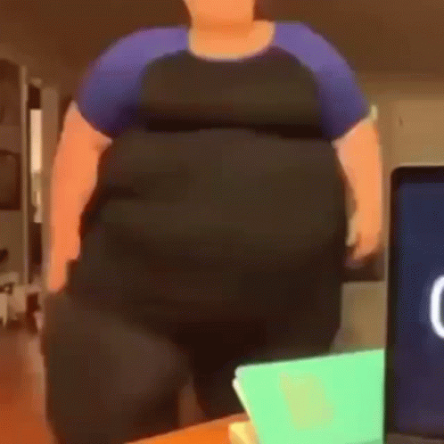 Cartoon Character With Large Belly in Front of Laptop