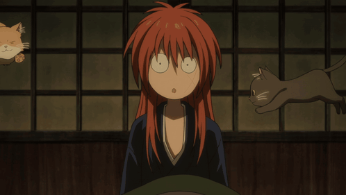 Cartoon Character with Red Hair Holding Three Cats