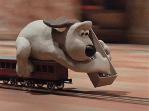 Cartoon Dog Carrying Box On Train Track GIF
