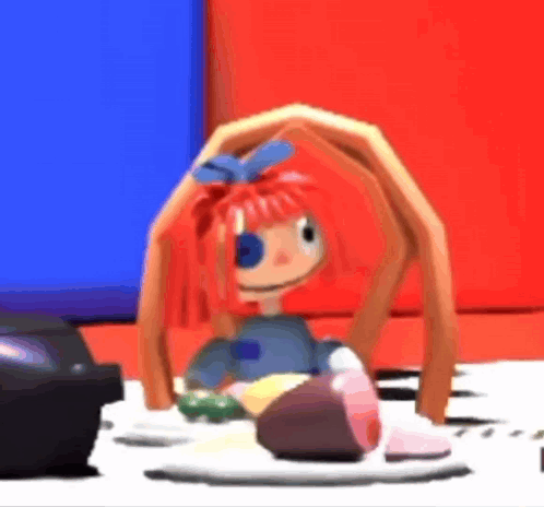 Cartoon Doll With Red Hair Sitting Next To Television GIF