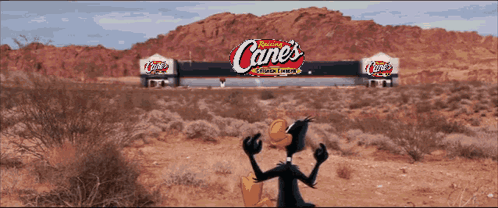 Cartoon Duck in Front of Canes Sign