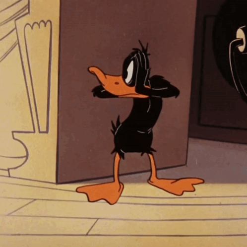Cartoon Duck Standing In Front Of Wall GIF
