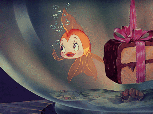 Cartoon Fish Swimming Beside Cake With Bow
