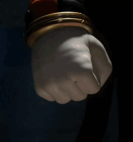 Cartoon Fist In Front Of Building GIF