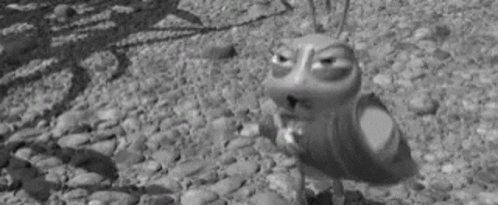 Cartoon Frog Standing On Rocky Surface GIF