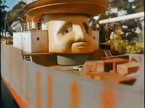 Cartoon Head On Top Of Building GIF