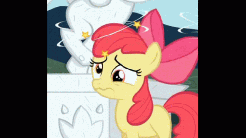 Cartoon Pony With Red Bow Next to Statue