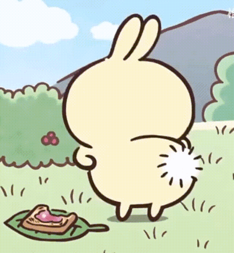 Cartoon Rabbit With White Tail Standing In Grass GIF