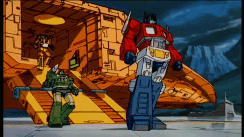 Cartoon Robot Optimus Prime Standing in Front of Building