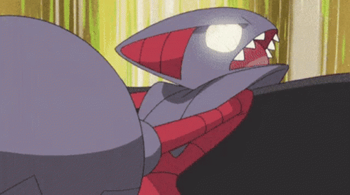 Cartoon Shark With Sharp Teeth And Glowing Eye GIF