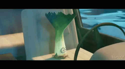 Cartoon With Leeks Head Sitting in Back Seat of Car