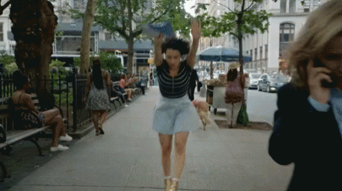 Playful Woman Cartwheel In The Street GIF